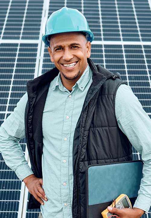 Person with solar panels and tools.